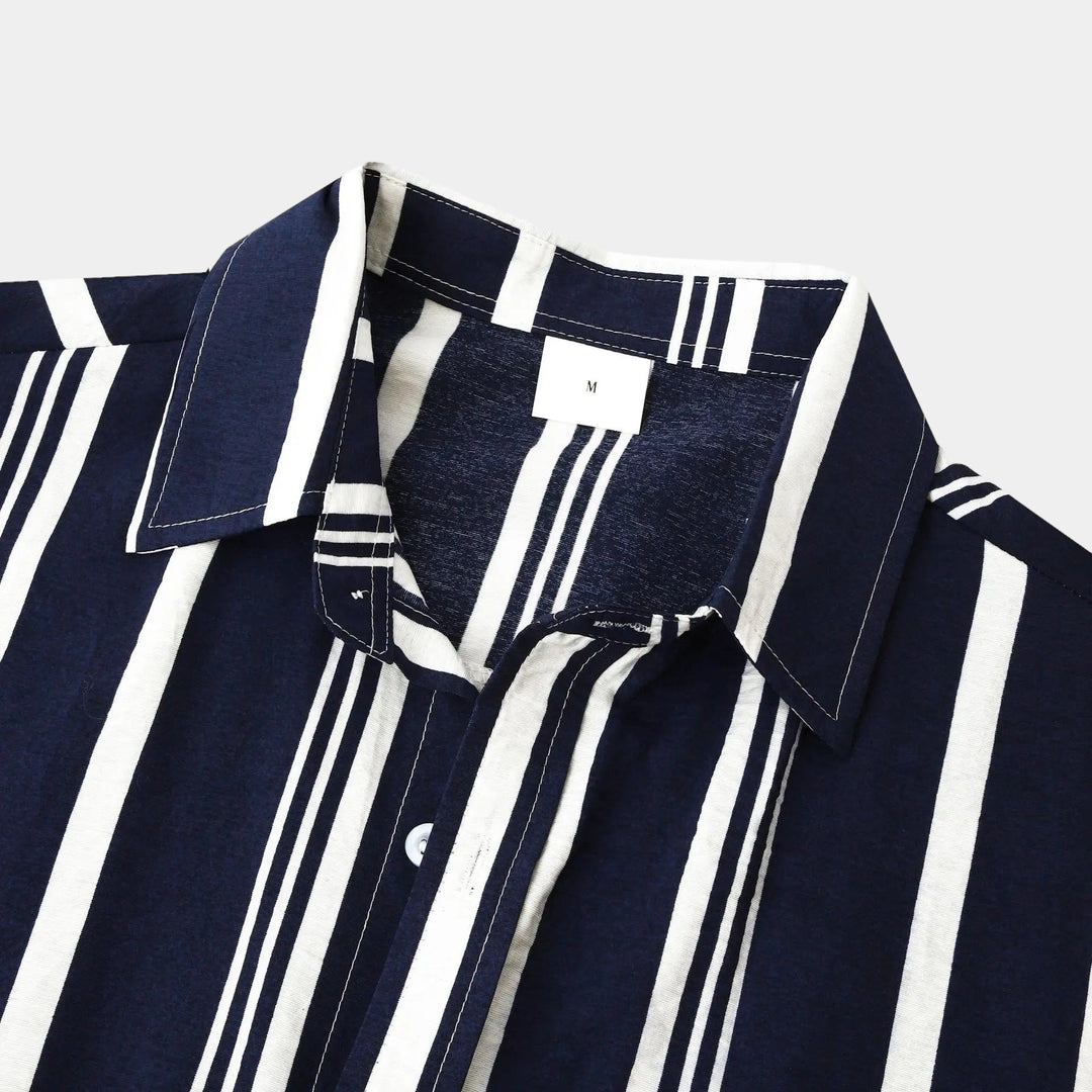 Close-up of shirt collar and chest area on navy striped casual button up shirt
