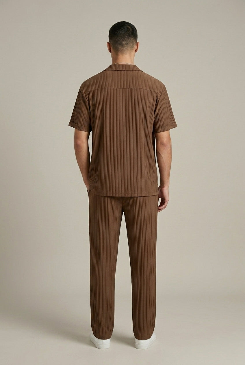 Back view of brown textured stripe shirt and pants set with relaxed fit, casual mens linen suit style