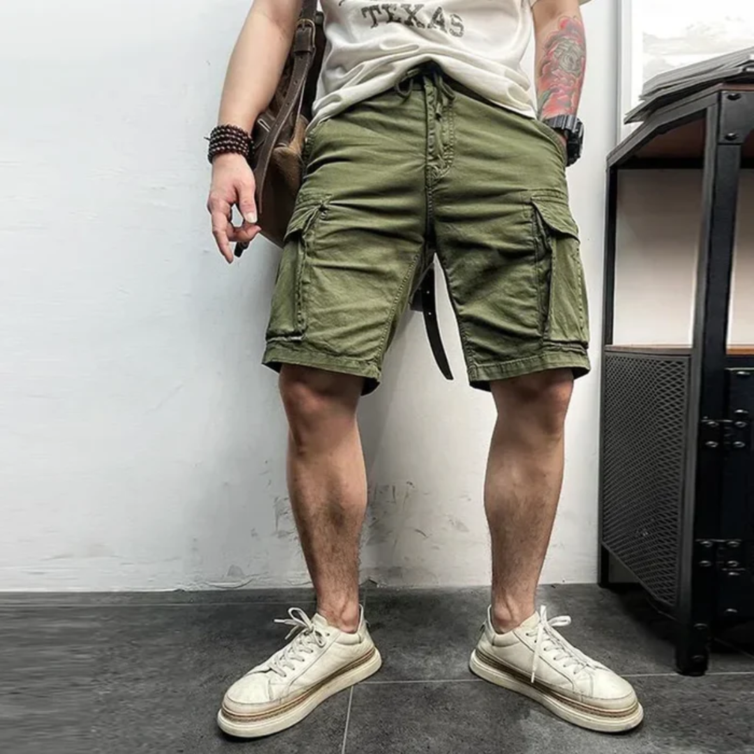 Khaki cargo shorts pocket close-up with flap closure and small logo patch