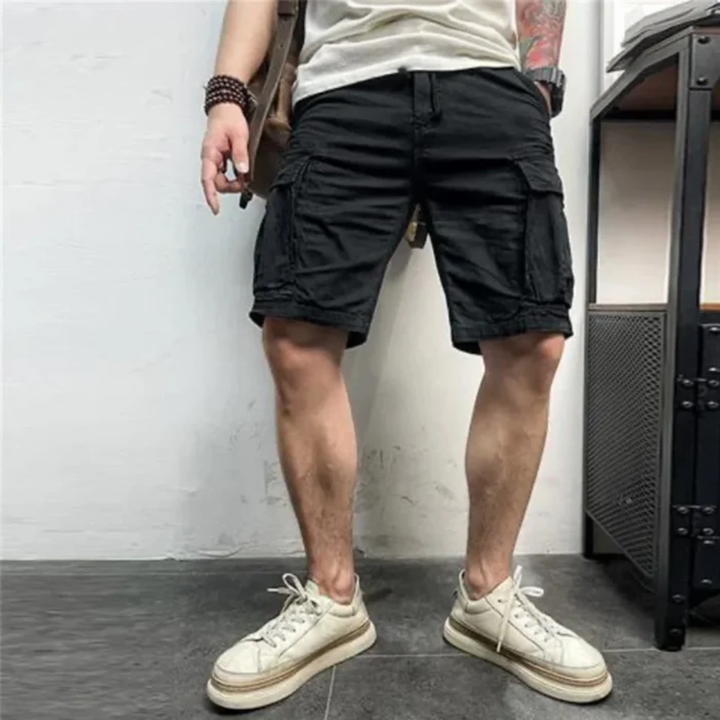 Black cargo shorts with belt, flap pockets, and relaxed knee-length style