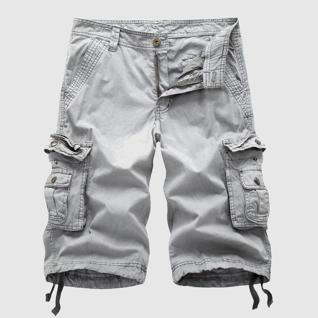 Light gray knee length cargo shorts with large flap pockets, snap buttons, and relaxed fit