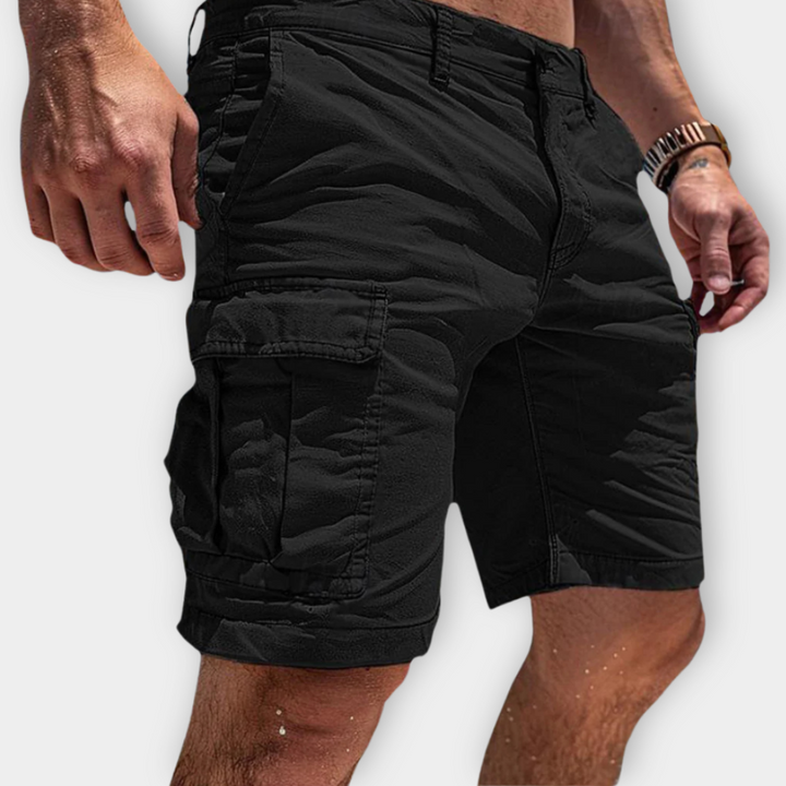 Black men's knee length cargo shorts with large side pocket, stitched seams and zip closure