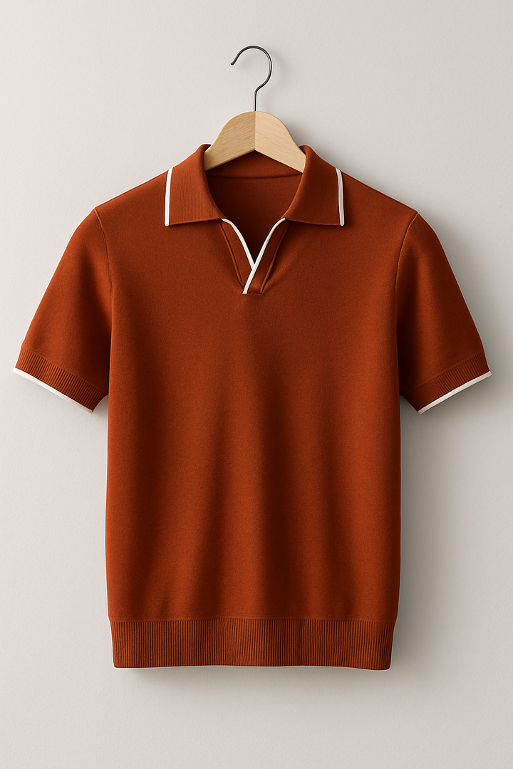 Hanging rust brown knit polo shirt with white contrast trim and ribbed hem