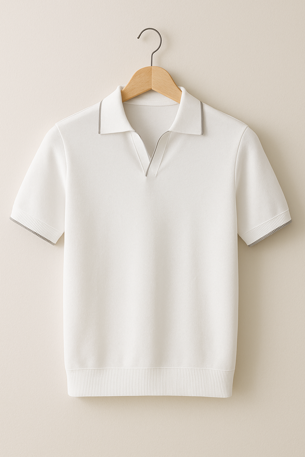 Hanging cream knit polo shirt with subtle contrast trim on collar and sleeves