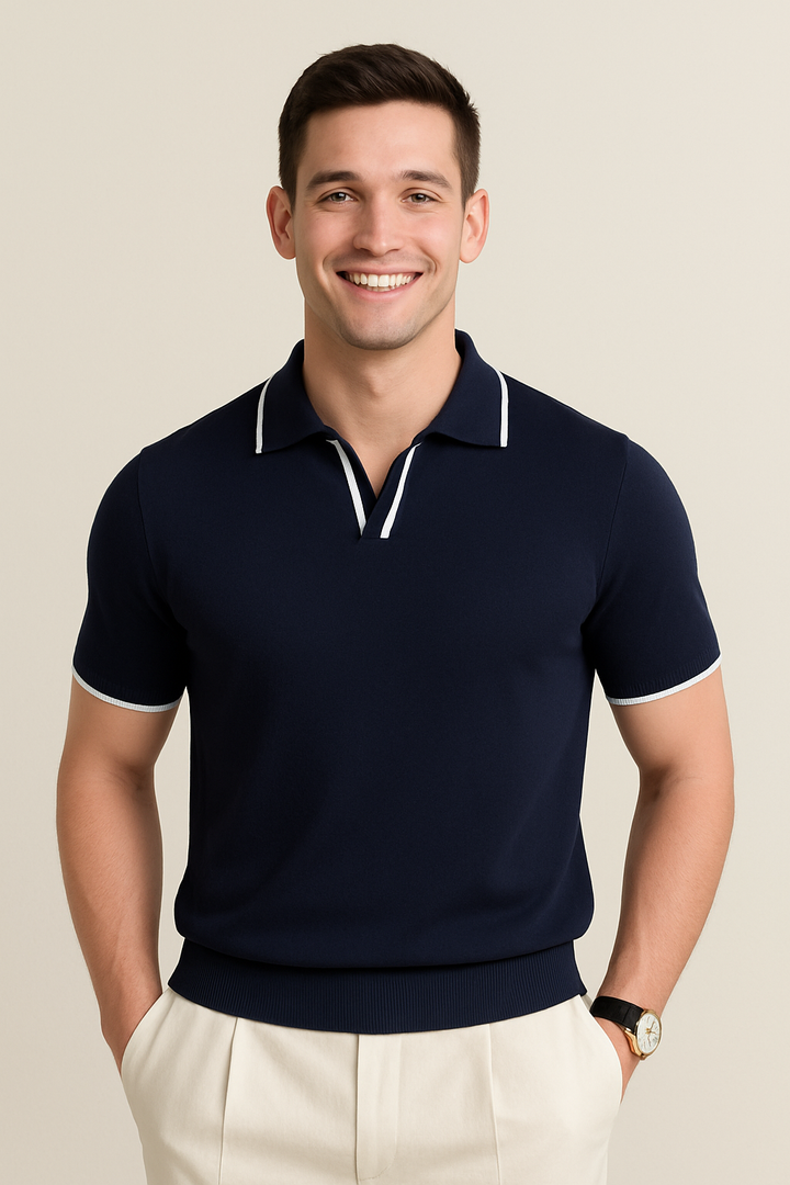 Navy knit polo shirt with white contrast trim on collar, placket, and sleeves