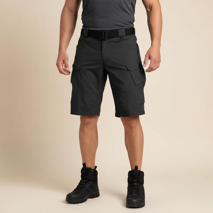 Black lightweight cargo shorts worn with boots, front view on a model