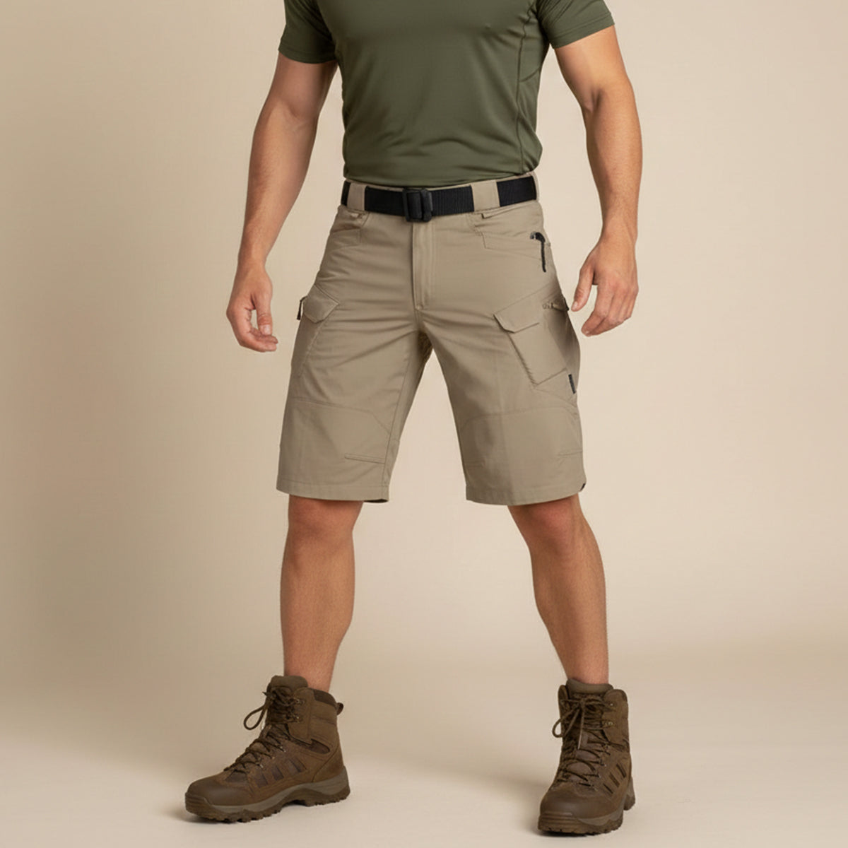 Front view of khaki tactical cargo shorts worn with olive shirt and boots