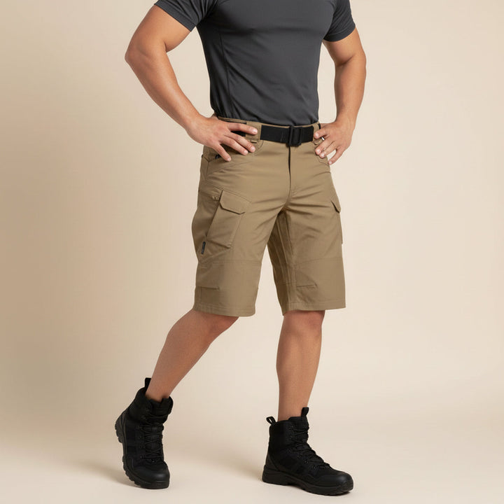 Close-up of khaki tactical shorts waistband with black belt and gathered elastic