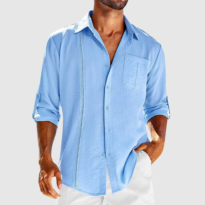 Light blue men's linen shirt long sleeve button front with chest pocket and rolled sleeves