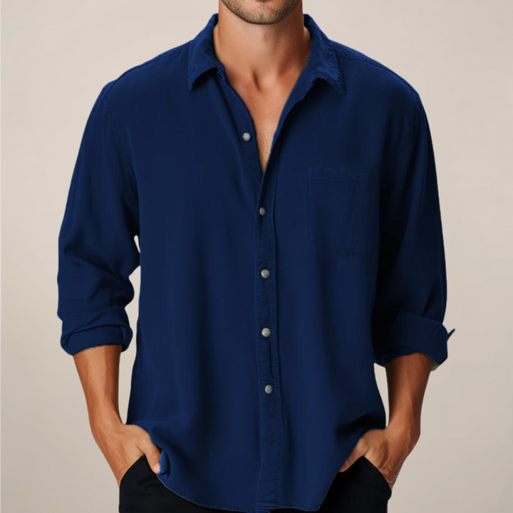 Navy men's long sleeve button up shirt with rolled cuffs and chest pocket