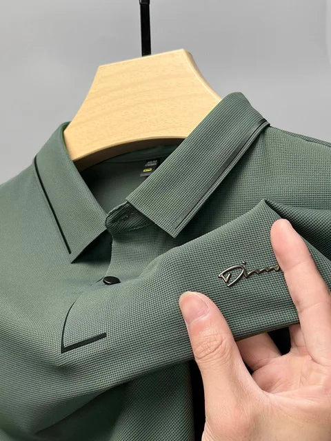 Green pique knit short sleeve polo shirt with textured finish and chest logo