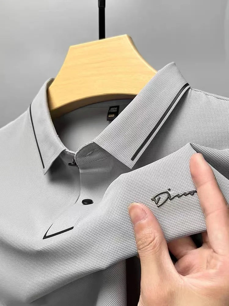 Light gray pique knit short sleeve polo shirt with black trim and textured fabric