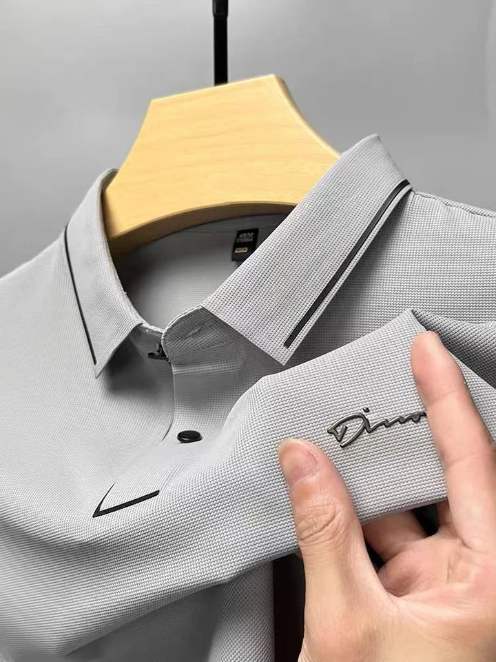 Light gray pique knit short sleeve polo shirt with black trim and textured fabric