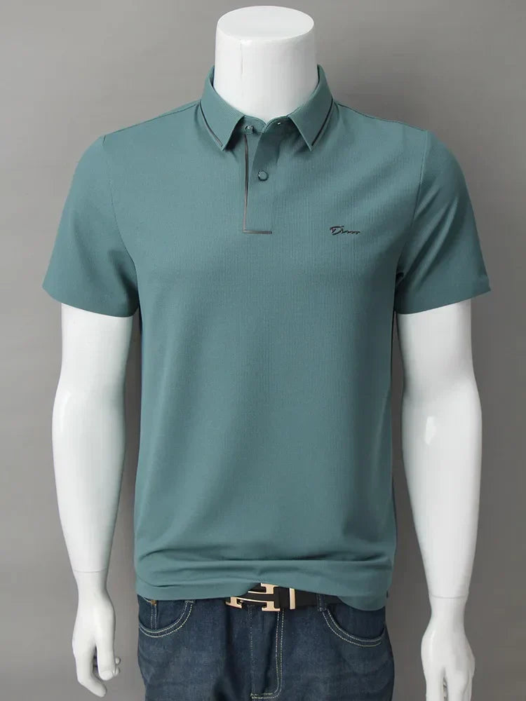 Teal green short sleeve polo shirt shown on mannequin with fitted casual menswear styling