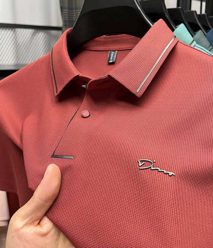 Rust red pique knit short sleeve polo shirt with contrast trim and button placket
