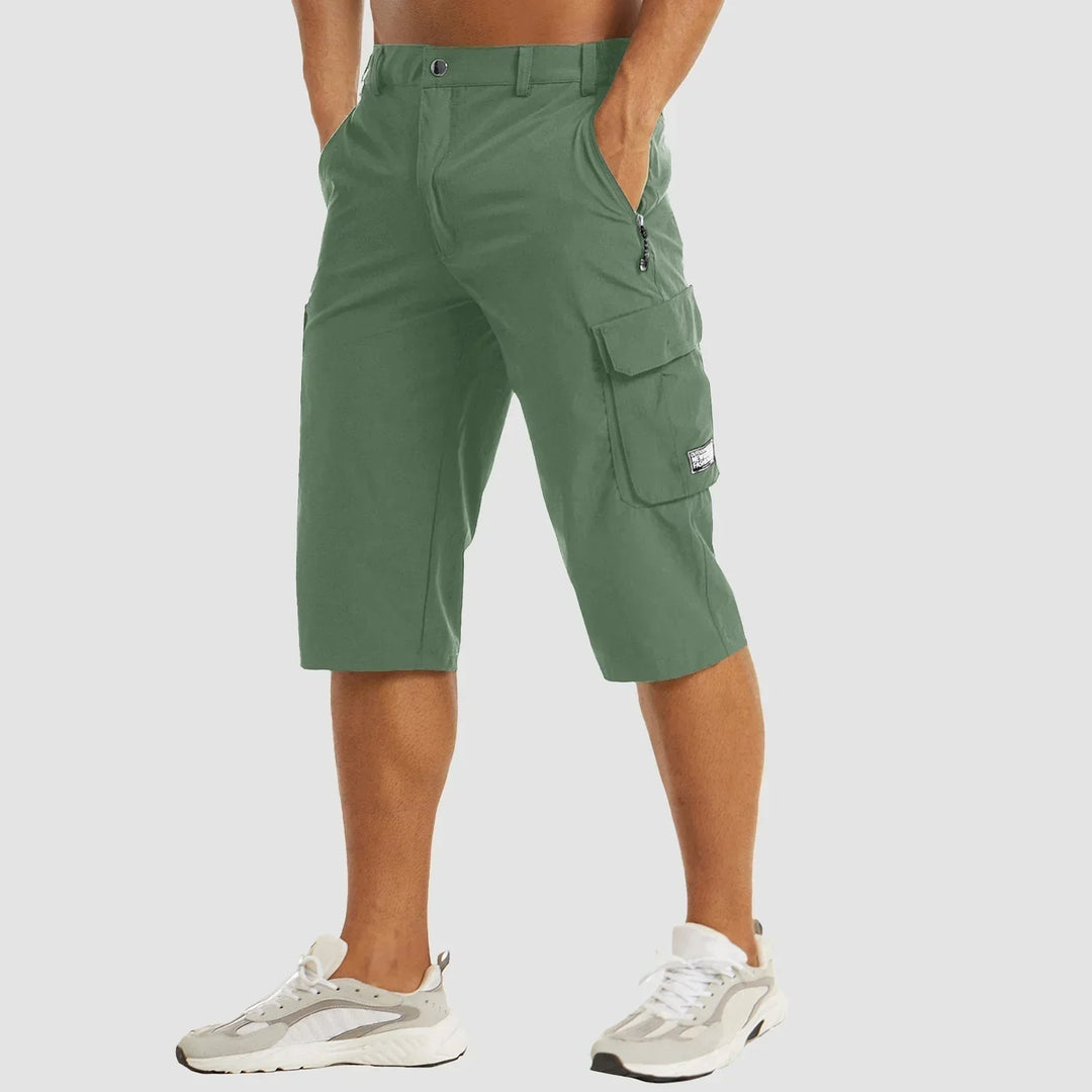 Green men's quick dry cargo shorts with zippered pocket detail and thigh cargo pocket, front view