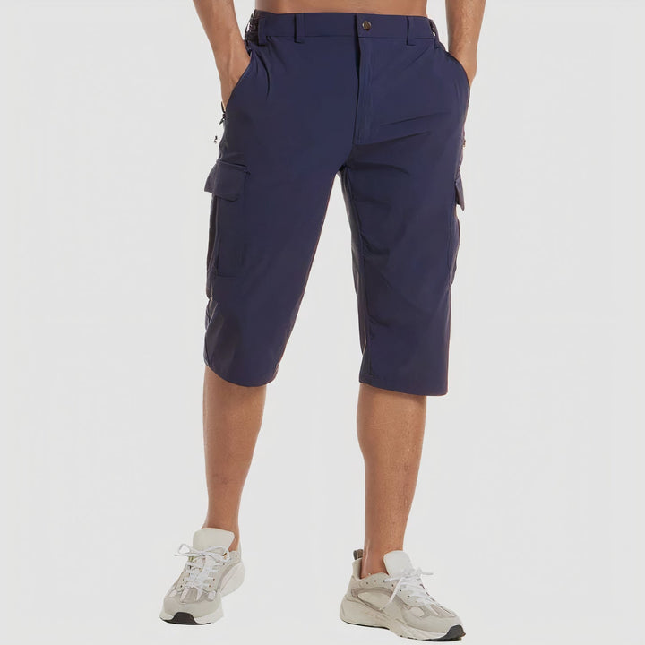 Back view of navy quick dry cargo shorts with elastic waist panels and side cargo pockets