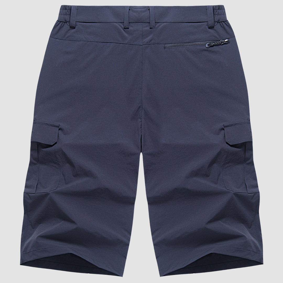 Navy quick dry cargo shorts flat lay back view with zippered back pocket and cargo pockets