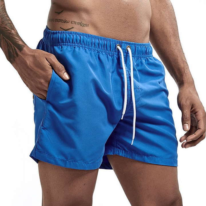 Royal blue men's quick dry swim shorts with white drawstring waist and side pockets, front view