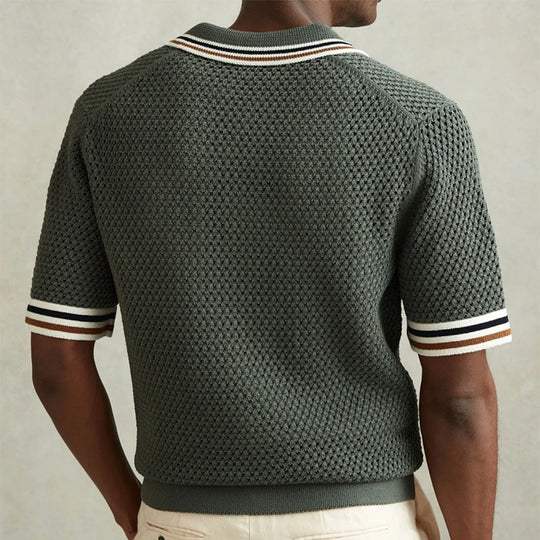 Back view of men's short sleeve knit polo shirt with dark green texture and striped collar and cuffs