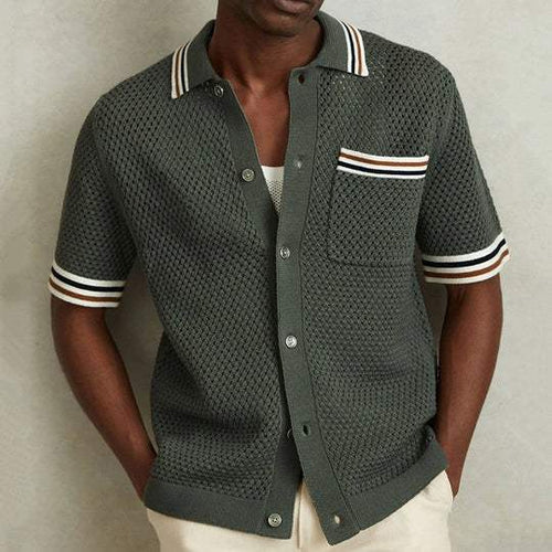 Men's short sleeve knit polo shirt in dark green with striped collar, chest pocket, and button front