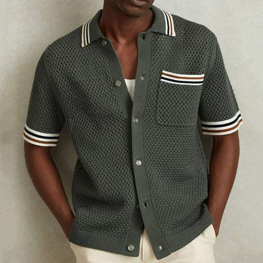 Men's short sleeve knit polo shirt in dark green with striped collar, chest pocket, and button front