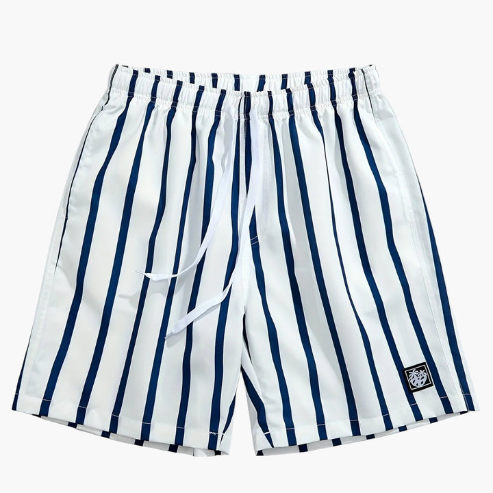 Men's white swim shorts with navy vertical stripes, drawstring waist, and logo patch