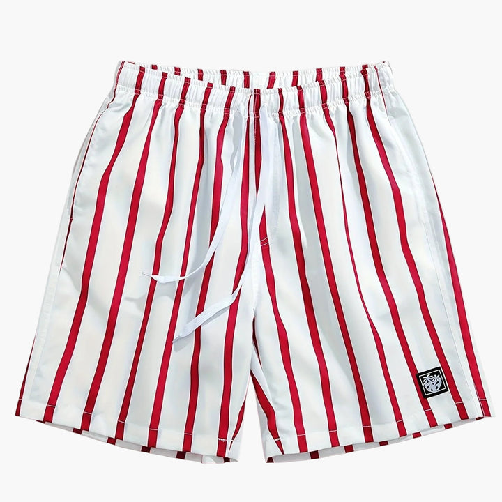 Men's white swim shorts with red vertical stripes, elastic waistband, and logo patch