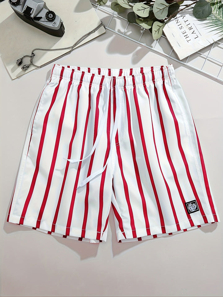 Men's white swim shorts with red vertical stripes, drawstring waist, and logo patch