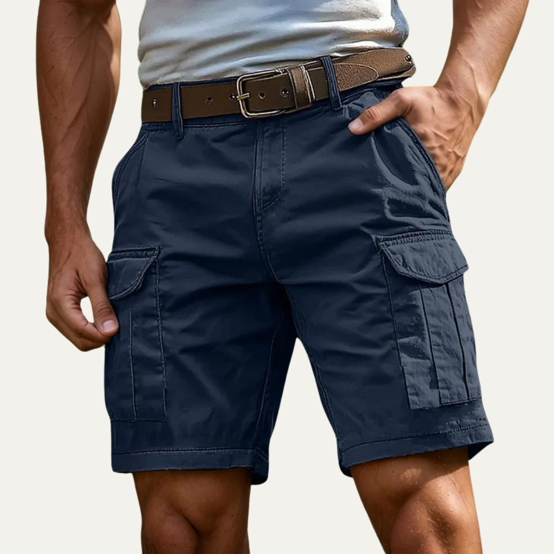 Navy blue cargo shorts for men with side flap pockets and knee-length cut