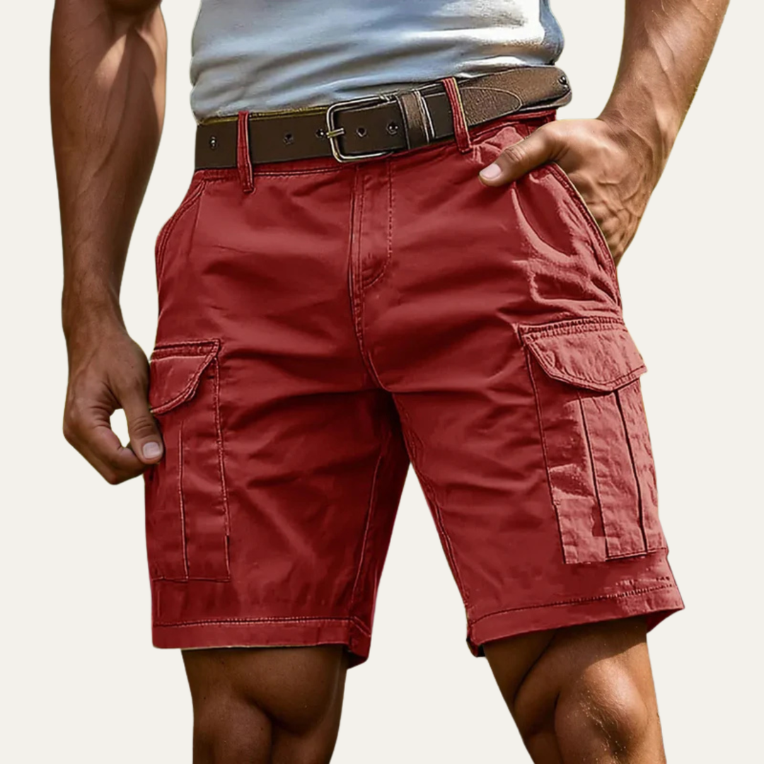 Red men's cargo shorts with multiple pockets and belt detail for warm weather