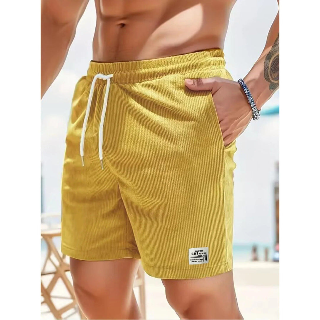 Yellow ribbed men's summer casual shorts with pockets, white drawstring and beach-ready style
