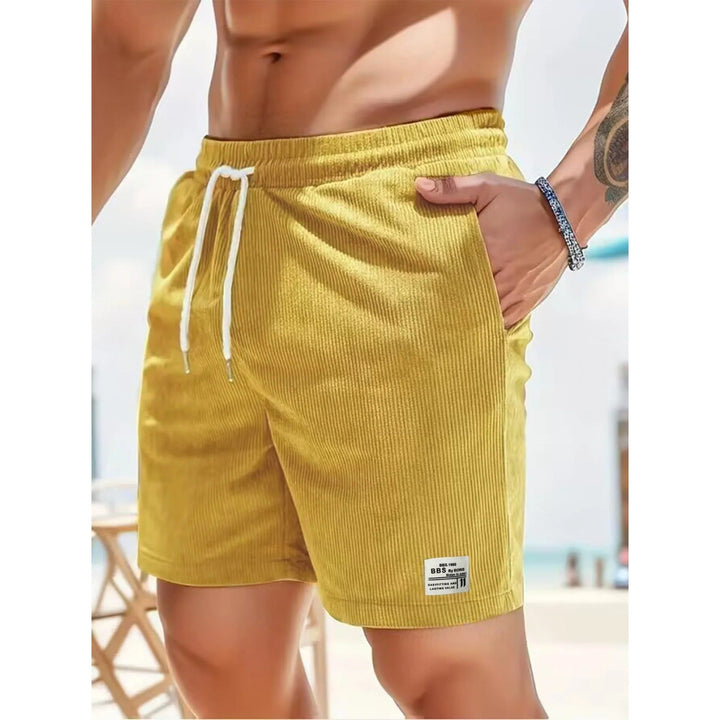 Yellow ribbed men's summer casual shorts with pockets, white drawstring and beach-ready style
