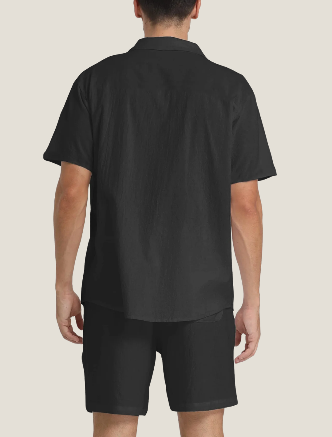Back view of black short sleeve shirt and shorts set, relaxed fit summer casual menswear