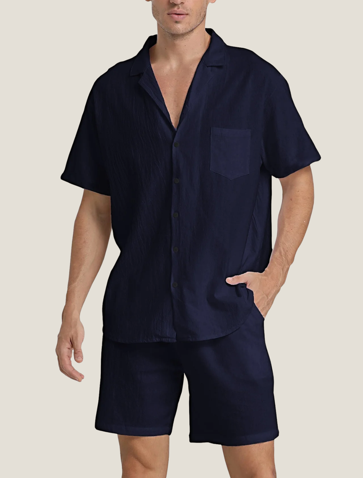 Navy short sleeve shirt and shorts set with open collar, chest pocket, and relaxed summer style