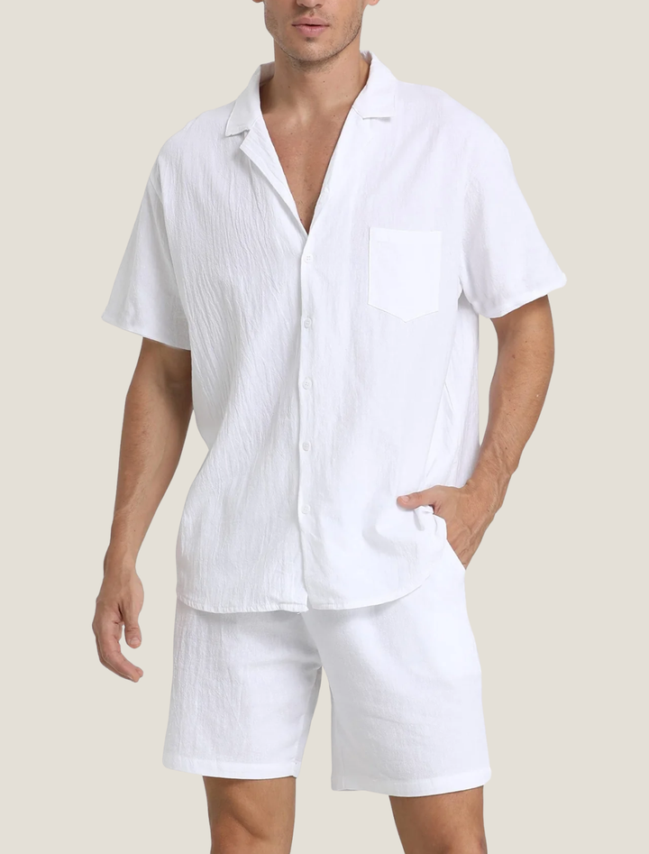 White short sleeve shirt and shorts set with open collar and chest pocket, clean casual summer look
