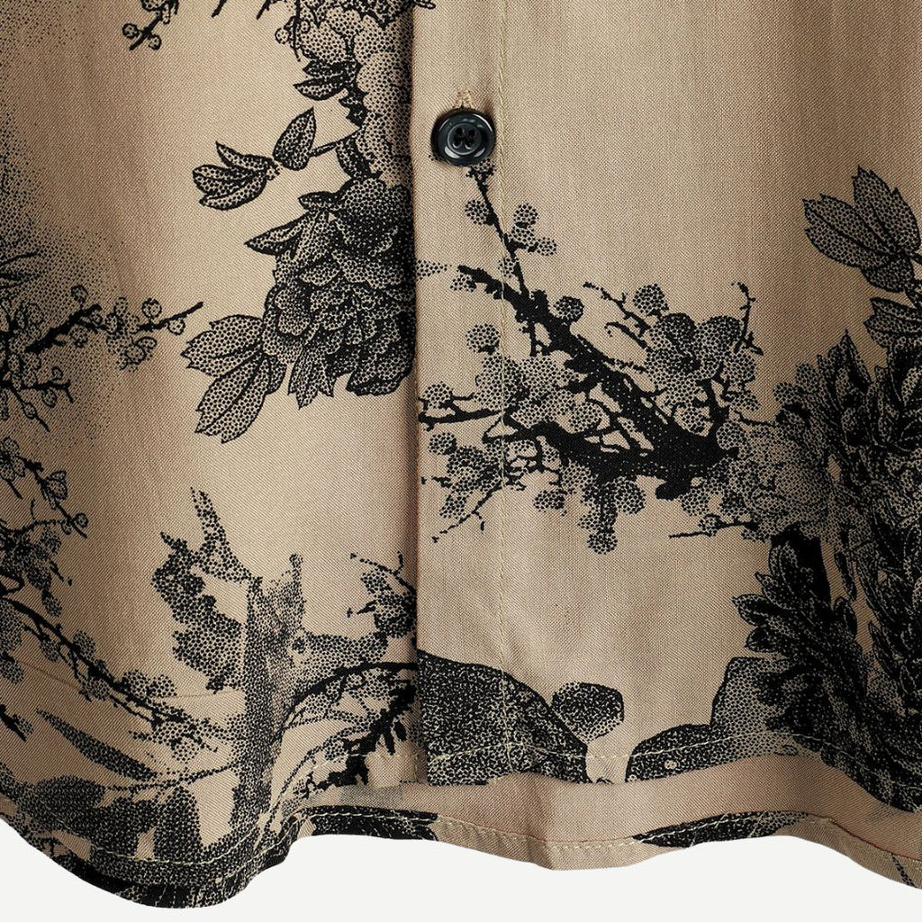 Close-up of shirt buttons and front placket on beige men's floral short sleeve shirt