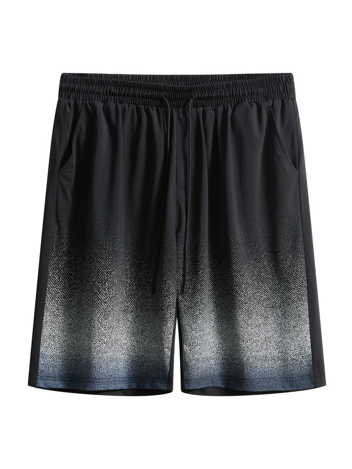 Flat lay of men's black gradient swim shorts with speckled hem and side pockets