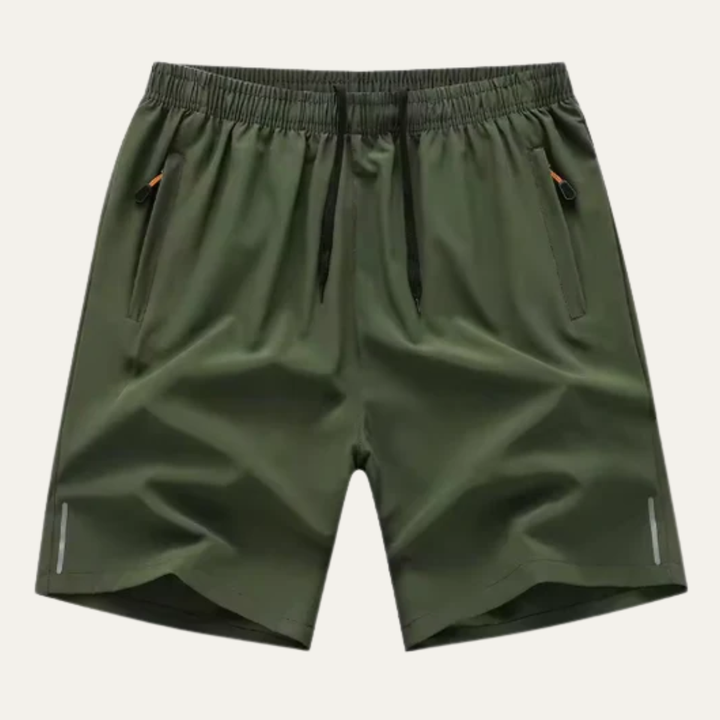 Olive green men's summer running shorts with elastic waist, side pockets, and reflective strips