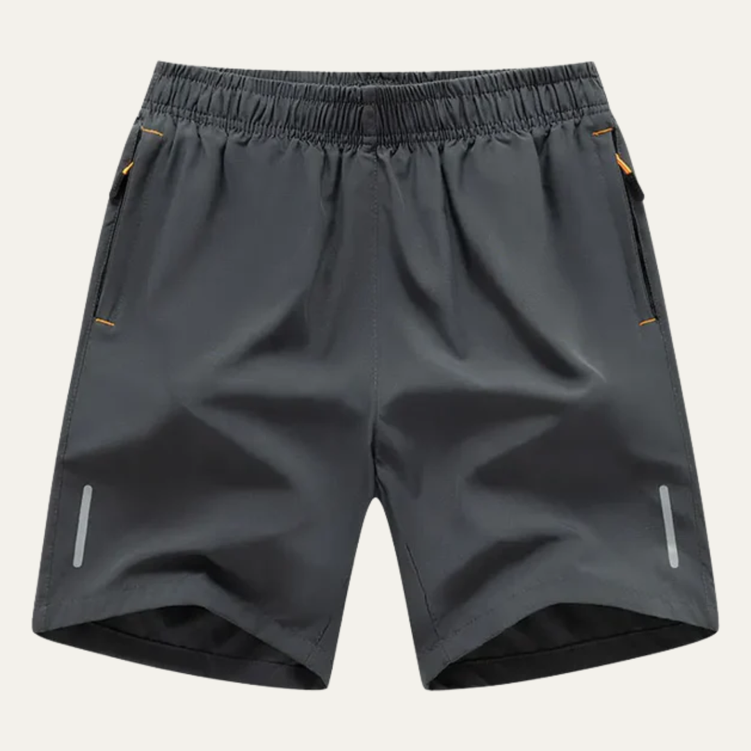 Dark gray men's summer running shorts with elastic waist, zip pockets, and reflective side strips