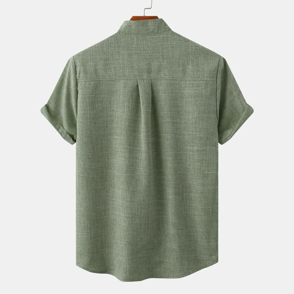 Back view of olive green summer linen shirt with band collar and rolled short sleeves
