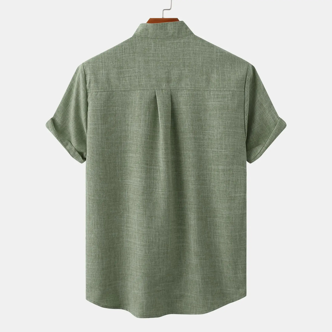 Back view of olive green summer linen shirt with band collar and rolled short sleeves