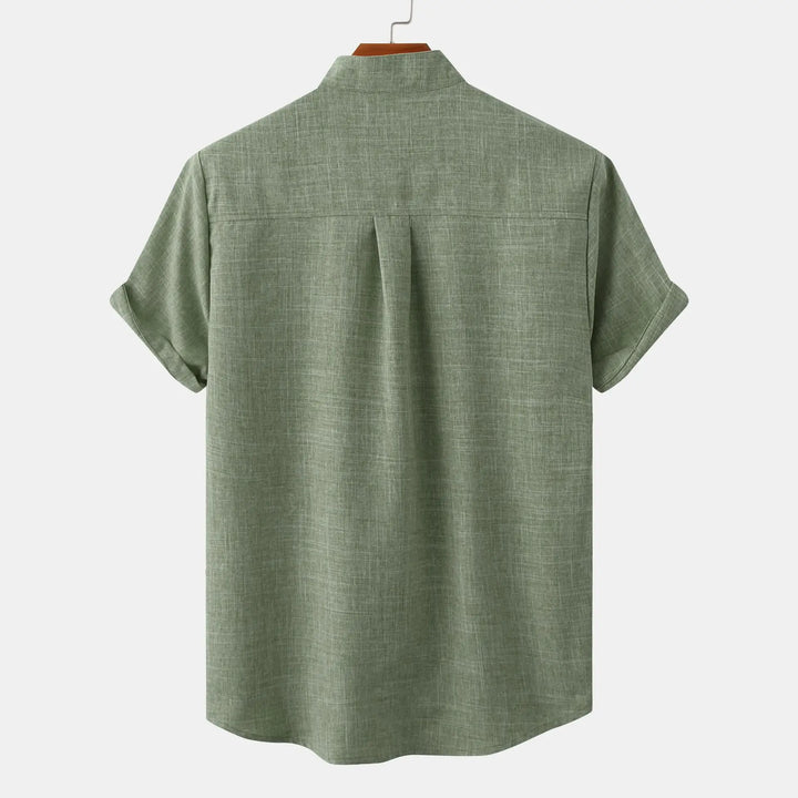 Back view of olive green summer linen shirt with band collar and rolled short sleeves