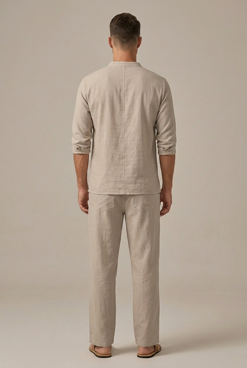 Back view of beige linen blend shirt and pants set with rolled sleeves and relaxed fit