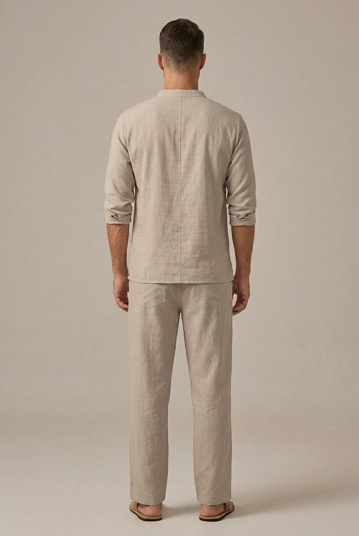 Back view of beige linen blend shirt and pants set with rolled sleeves and relaxed fit