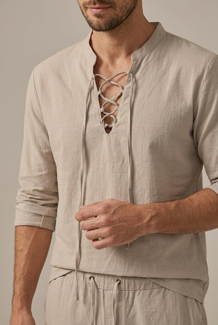 Close-up of beige lace up V neck linen shirt with long ties and matching drawstring pants