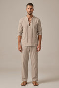 Beige men's linen blend set with lace-up V neck shirt and straight leg pants, front view