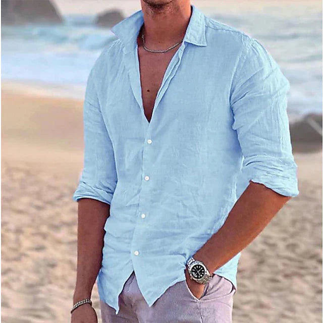 Light blue men's linen button down shirt with open collar and rolled long sleeves