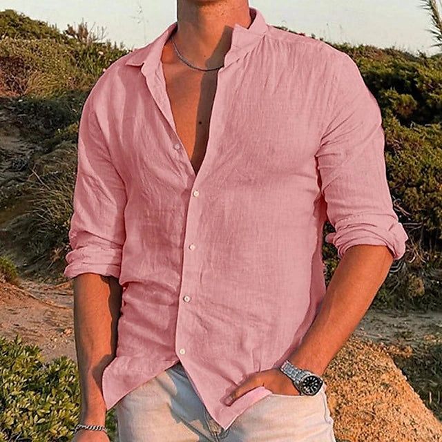 Pink men's summer linen shirt with relaxed fit, open collar, and rolled long sleeves outdoors