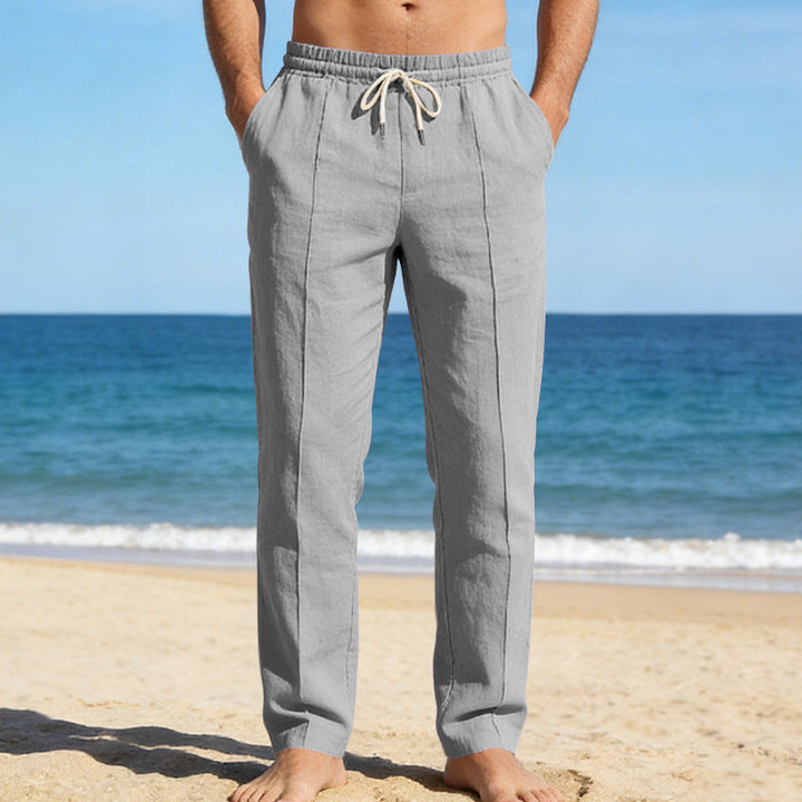 Light gray men's linen slacks with straight leg cut and soft summer fabric texture